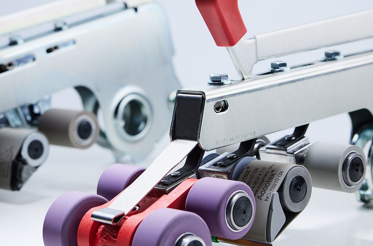 Suessen top weighting arms